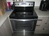 (LOT) WHIRLPOOL STOVE, (6) ASSORTED MICROWAVES, (24) STACKABLE CHAIRS, (3) PLANTERS, WHITE BOARD AND ICE CHEST - 4
