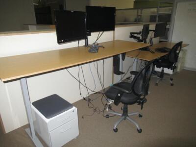 (5) ADJUSTABLE HEIGHT DESKS, (5) CHAIRS, (5) STORAGE CABINETS, AND (1) SMALL ROUND TABLE
