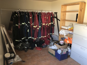 Lot of Asst. Cover-Alls, Safety Supplies, 4-Drawer Lateral Filing Cabinet, Shelving, etc. Located at 310-2nd Ave. Fox Creek, AB T0H 1P0