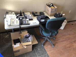 Lot of Asst. Phones, CB Radios, Modem, Projector, Plastic Table, Asst. Radios, etc. Located at 310-2nd Ave. Fox Creek, AB T0H 1P0