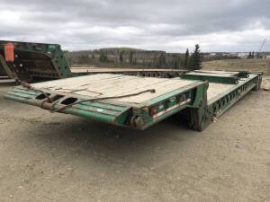 2007 Scona 16LB Tandem-Axle 16-Wheel Scissorneck Lowboy Trailer 52' kicker roll with 10" live roll, Spare front neck extention Serial No 2E9L60F4X73003982 Unit No 2221 Located at 2020 1st Ave. Edson, AB, T7E 1T8