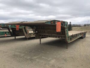 2001 Knight SL040-FGN FD03 Tri-Axle Scissor Neck Lowboy Tridem Trailer 50' 40 ton with center live roll and 10" live roll Serial No 2K9LB35111L036081 Unit No 2212 Located at 2020 1st Ave. Edson, AB, T7E 1T8