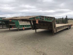 2005 Arnes Tri-Axle Scissor Neck Tridem Lowboy Trailer 52' with center live roll 10" live roll Serial No 2A91252355A003933 Unit No 2219 Located at 2020 1st Ave. Edson, AB, T7E 1T8