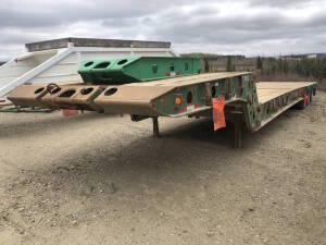 2000 Knight Tri-Axle Scissor Neck Tridem Lowboy Trailer 50' with center live roll 10" live roll Serial No 2K9LB3508YL036127 Unit No 2208 Located at 2020 1st Ave. Edson, AB, T7E 1T8