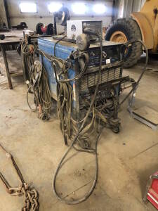 Miller Dimension 452 Welder , Atra-Arc AMS-22A Wire Feeder w/ Steel Stand, Spoolmatic 30A Gun, Welding Helmet, etc. Located at 2020 1st Ave. Edson, AB, T7E 1T8