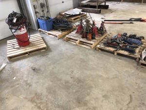 Lot of (4) Pallets of Asst. Jack Stands, Bottle Jacks, Grease Keg w/ Grease Pump, Caulking Guns, Grease Guns, Hose, Nylon Sling, etc. Located at 2020 1st Ave. Edson, AB, T7E 1T8