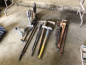 Lot of Asst. Pipe Wrenches, Pry Bars, Pick Axes, Mallets, Hammer, etc. Located at 5603-50 Ave. Warburg, AB T0C 2T0