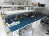 4-PERSON DOUBLE SIDED LAB WORK TABLES WITH OVERHEAD LIGHTS AND SHELF, AND 6'FT LAB WORK TABLE, (NO CONTENTS), (LAB NEXT TO FRONT OFFICE) - 3