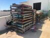 LOT, STACK RACK PARTS, MOSTLY BASES, VERY FEW POLES, APPROXIMATELY 150 BASES, LOCATED OUTSIDE - 4