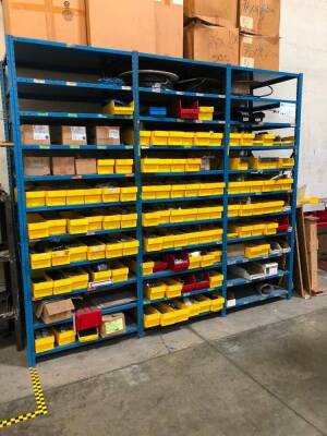 LOT, 8 ROWS OF METAL SHELVING, 1 ROW AGAINST WALL, APPROXIMATELY 99 SECTIONS, INCLUDES SHELF CONTENTS (MOSTLY SPARE PARTS), 2 YELLOW CABINETS, MISC FURNITURE