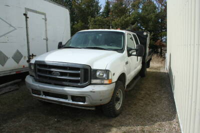 2002 Ford F350 super duty crew cab 4x4 service truck, 5.4 liter gas engine, auto trans. s/n 1FTSW31L32EB80629, 2002 Ford 350 crew cab 4_4, 5.4 l gas engine, auto trans., bench seats front and back, LT245/75r16 tires like new, 12 ft deck, tool boxes, fuel