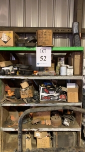 LOT OF ASST SCAG PARTS, AIR FILER, BELTS, BEARINGS, ANTI SCALP WHEELS, BAR FRAME W/ WOOD SHELVES 