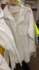 LOT OF ASSTD CLOTHING: RAIN COATS, VESTS, LAB COATS, AND T - SHIRTS WITH ROUND RACK - 6