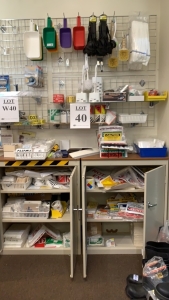 LOT OF ASSTD SIGNS, HAZARD STICKERS AND SCOOPS WITH (2) STORAGE CABINETS, BOOK CASE AND WALL WIRE RACK