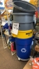 LOT OF ASSTD ITEMS: APPRX 120 PAIRS OF WORK GLOVES, EXTENSION CORDS, WATER HOSE, TRASH CANS, WATER JUGS, HEAVY DUTY C - CLAMPS, BRAKE FLUID, BOOSTER CABLES, HOOK SETS, AND HANGING BRACKETS WITH SHELVING AND RACK - 3
