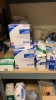 LOT OF ASSTD MEDICAL SUPPLIES: BAND AIDS, STING RELIEF PADS, SPORT TAPE, COHESIVE BANDAGES, BZK TOWELETTE, TONGUE DEPRESSORS, GAUZE PADS WITH 2 RACKS - 2