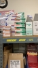 LOT OF ASSTD MEDICAL SUPPLIES: BAND AIDS, STING RELIEF PADS, SPORT TAPE, COHESIVE BANDAGES, BZK TOWELETTE, TONGUE DEPRESSORS, GAUZE PADS WITH 2 RACKS - 3