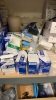 LOT OF ASSTD MEDICAL SUPPLIES: BAND AIDS, STING RELIEF PADS, SPORT TAPE, COHESIVE BANDAGES, BZK TOWELETTE, TONGUE DEPRESSORS, GAUZE PADS WITH 2 RACKS - 7