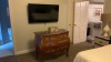 ROOM 2300 FURNITURE: KING SIZE BED FRAME, KING SIZE FOUR POST BED FRAME, SOFA, KEURIG COFFEE MAKER, COMMODE, MINI FRIDGE, LAMPS, NIGHT STAND, (3) SAMSUNG TELEVISION, (2) DESKS WITH CHAIRS, COMMODE, COFFEE TABLE WITH CHAIRS & IRON ( NO FIXTURES: LIGHT FIXT - 8