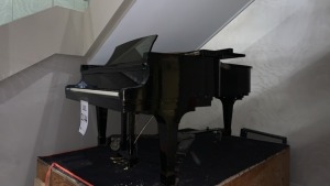 K. KAWAI PIANO MODEL KG-6C (ON TOP OF WOOD CRATE)(LOCATION: LOBBY END OF BIG BALLROOM)
