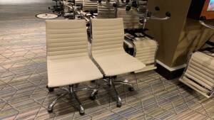 LOT OF (50) CHARTER FURNITURE WHITE PNEUMATIC CHAIRS (MUST TAKE LOTS AS STACKED, PLEASE INSPECT) (SOME HAVE RIPS AND LOOSE FABRIC) (LOCATION: MAIN LOBBY)