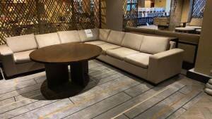 L SHAPED 7 PERSON SOFA WITH 54 INCH ROUND WOOD TABLE AND SQUARE TABLE 30 INCH X 30 INCH (LOCATION: LOBBY LOUNGE)