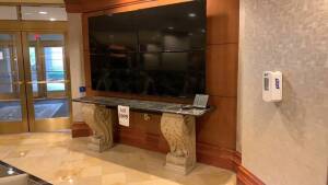 AVON TILE COMPANY TABLE WITH MARBLE TOP AND CEMENT BASE 8FT X 21 INCHES X 34 INCHES WITH (4) 50 INCH SAMSUNG TELEVISIONS (NO REMOTE OR POWER CABLES) (MARBLE TOP HAS CRACKS) (LOCATION: MAIN LOBBY)
