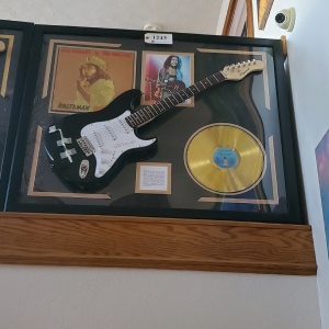 FRAMED BOB MARLEY AND THE WAILERS MEMORABILIA WITH ELECTRIC GUITAR AND “RASTAMAN VIBRATION” RECORD (SIGNATURE IS UNAUTHENTICATED) (43X35)