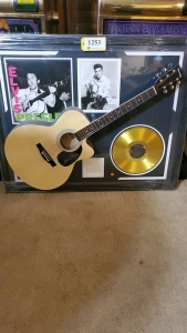 FRAMED ELVIS MEMORABILIA WITH ACOUSTIC GUITAR AND RECORD (SIGNATURE IS UNAUTHENTICATED) (43X35)