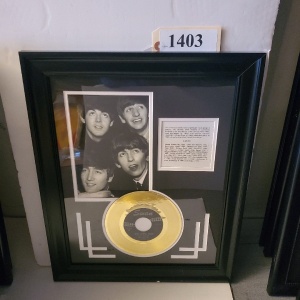 FRAMED MEMORABILIA OF THE BEATLES (17X21)