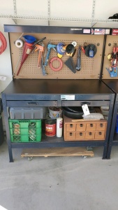 47 INCH WORK BENCH WITH TOOLS AND PARTS