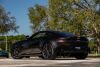 2019 Aston Martin Vantage finished in Kopi Bronze over Pure Black/ Californian Poppy Leather. 503 hp 4.0L Twin Turbo V8 Engine, 8 Speed automatic transmission, 3 Drive Modes - Sport Sport+ and Track - 7