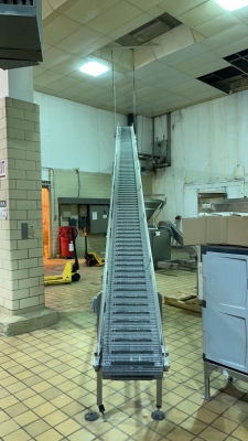 INCLINING STAINLESS STEEL POWERED CONVEYOR APPROX.: 334" X 35 1/2" X 156" WITH 14" PLASTIC CHAIN (COOKING AREA)