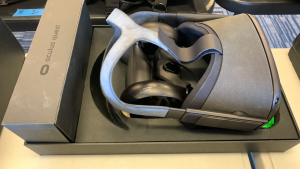 OCULUS QUEST ALL IN ONE VR GAMING HEADSET WITH CONTROLS AND CHARGER (LOCATION: CECILIA HALL)