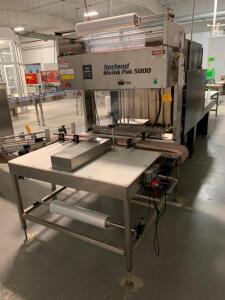 Norland International Shrink Pak 5000 Automatic Shrink Wrapper. Serial Number 5477. Max Speed 12 packages per minute, Bottle size 4.5" to 16.5" Tall, 3.0" Film Core, Max Case Size 28" x 16", PLC Controls, approx 82" x 58" x 60"<br><br />